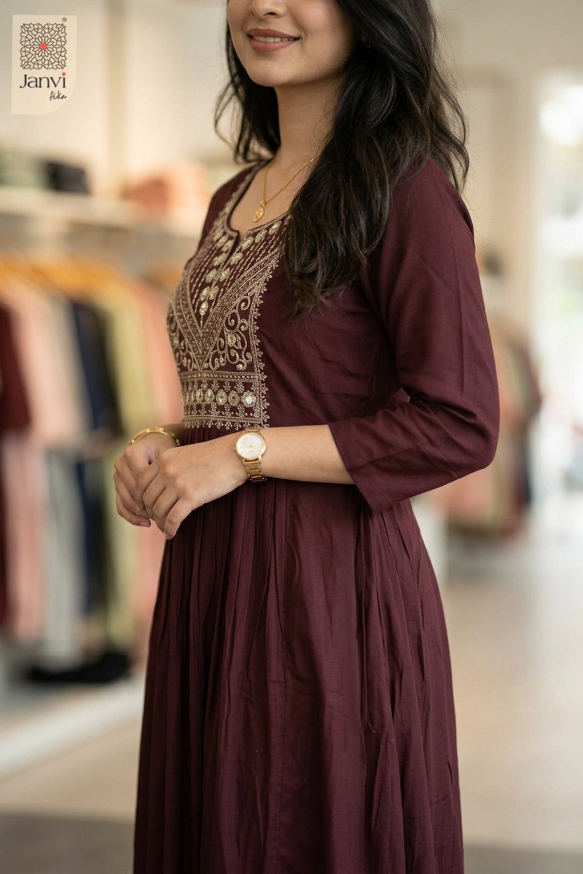 Side profile of model wearing fancy tops for women in a very dark red embroidered cut