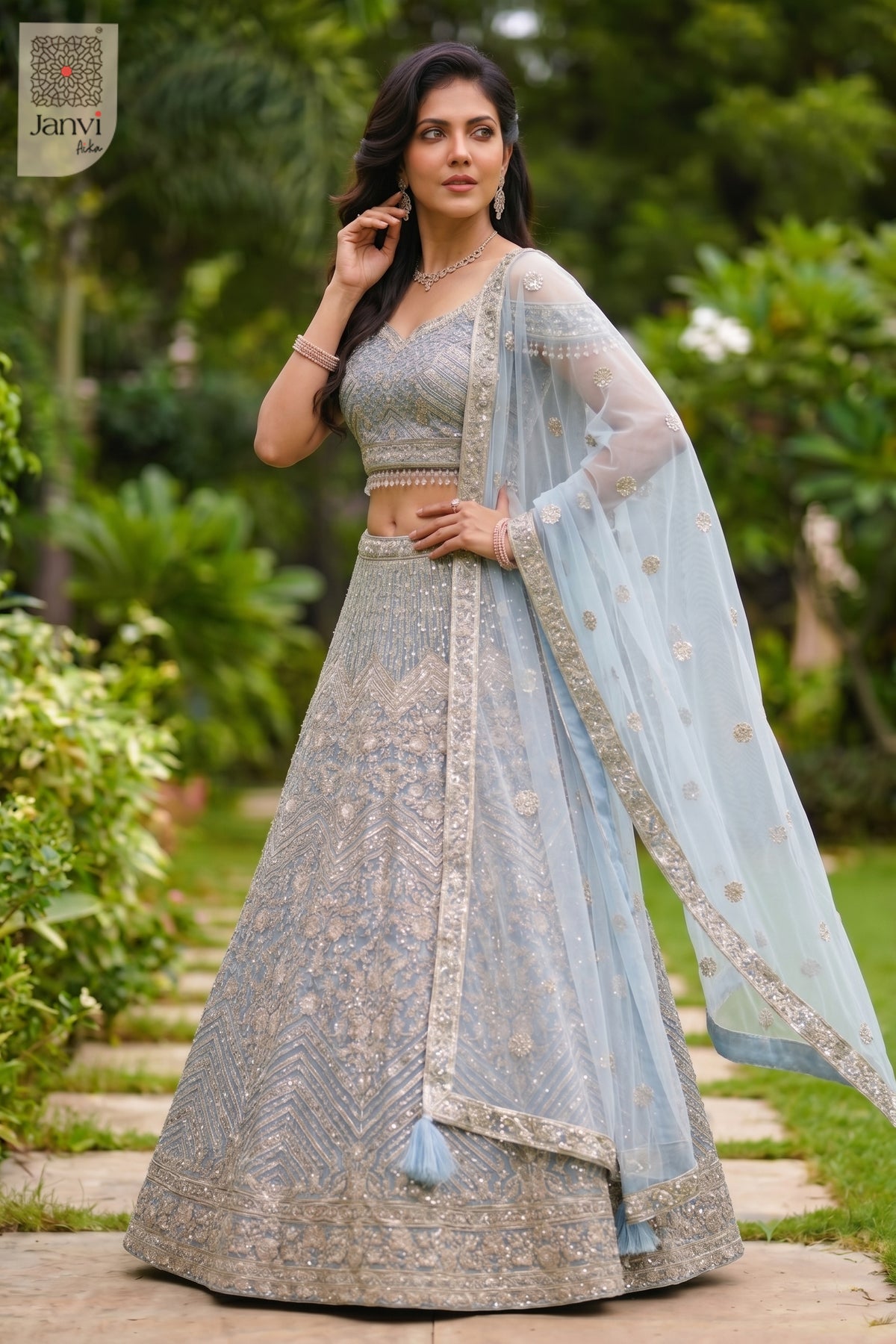 Charming set saree model lehenga showing a lovely front full standing shot in a ice blue net style.