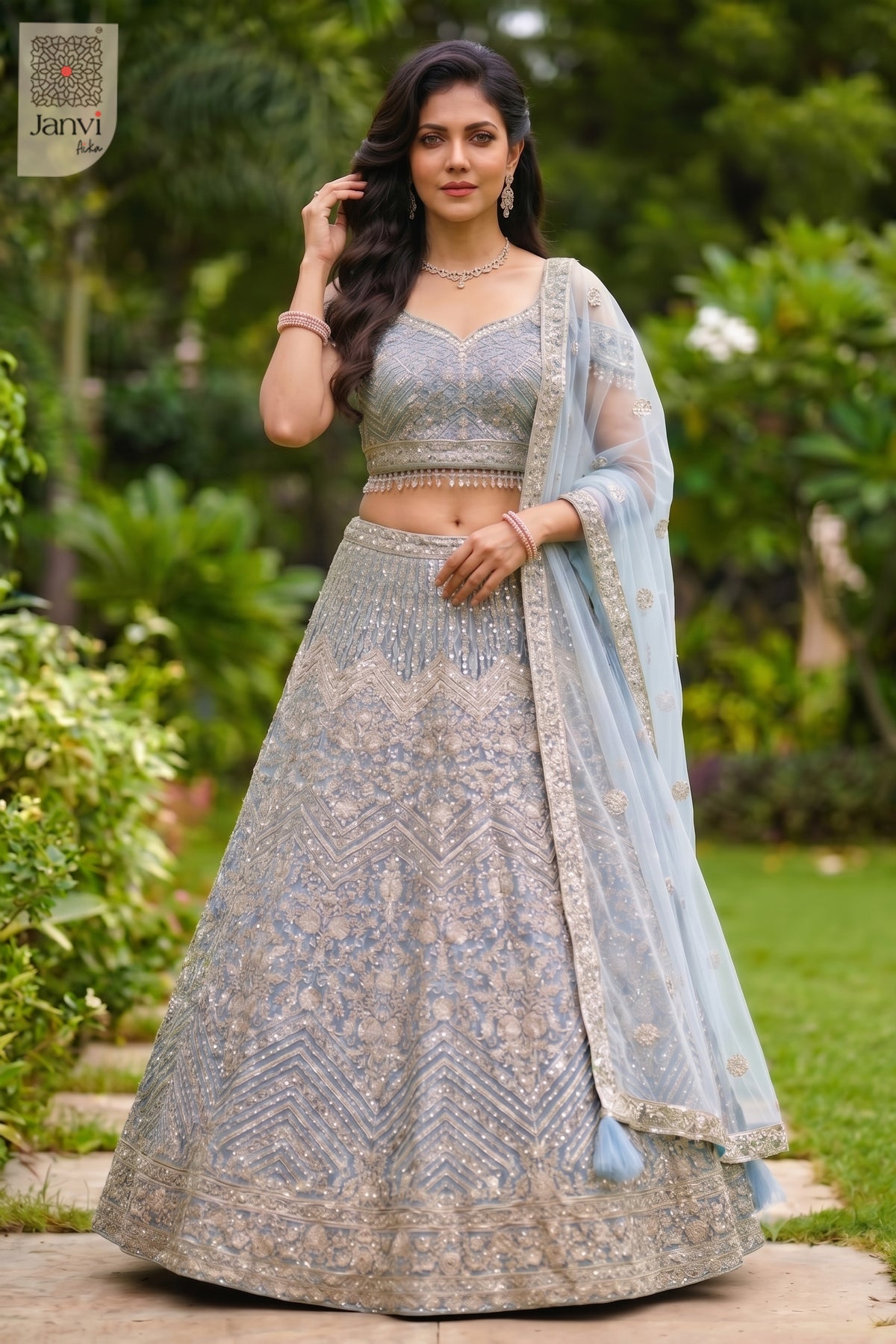 This front full standing shot showcases a gorgeous ice blue net lehenga for weddings.