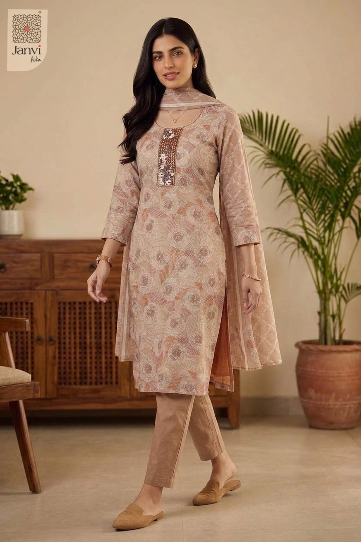 Mid length front standing pose in tailored light peach red churidar sleeves kurti.