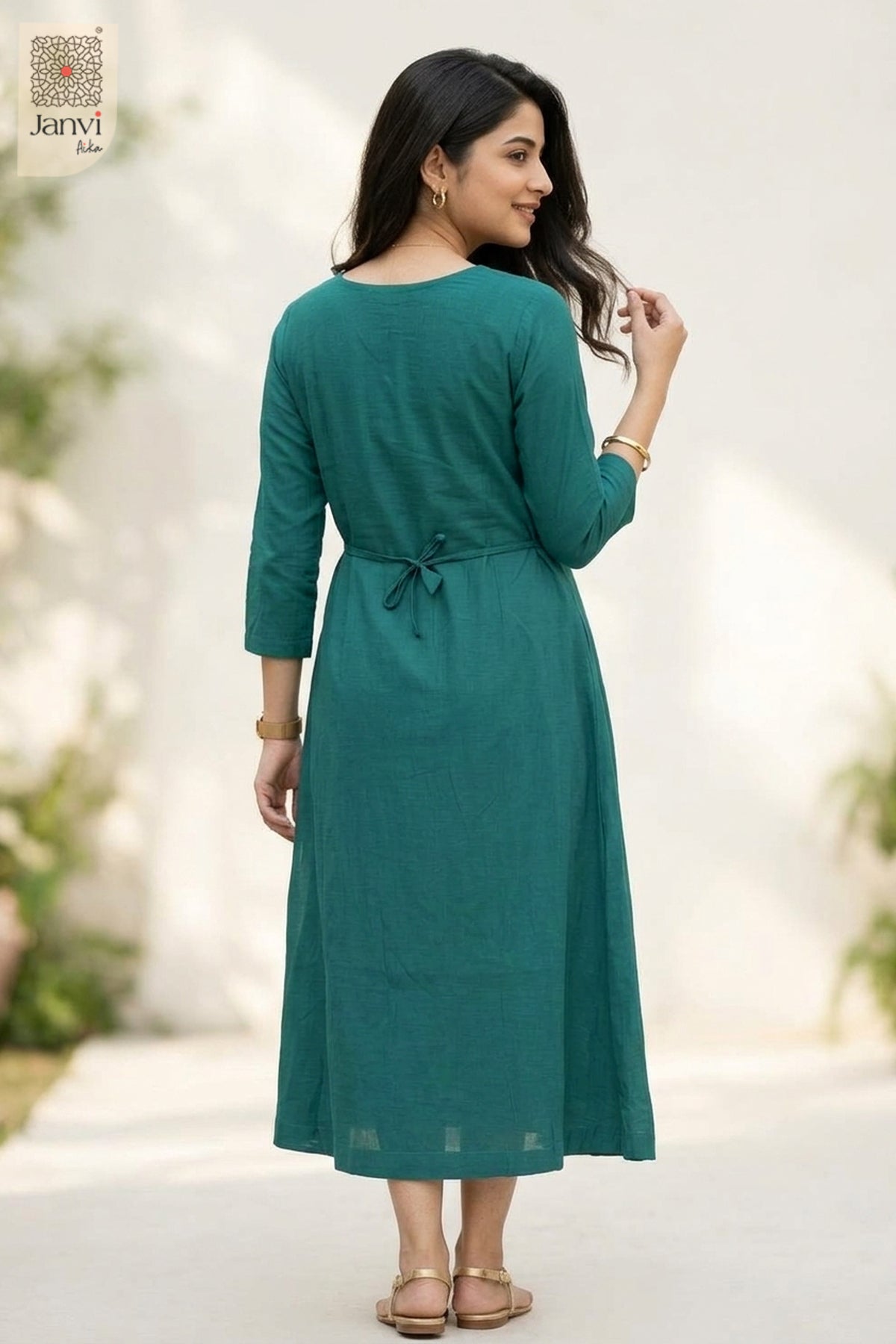 Back view of dark cyan flared 3 4 sleeve tops for women with back string tie outdoor