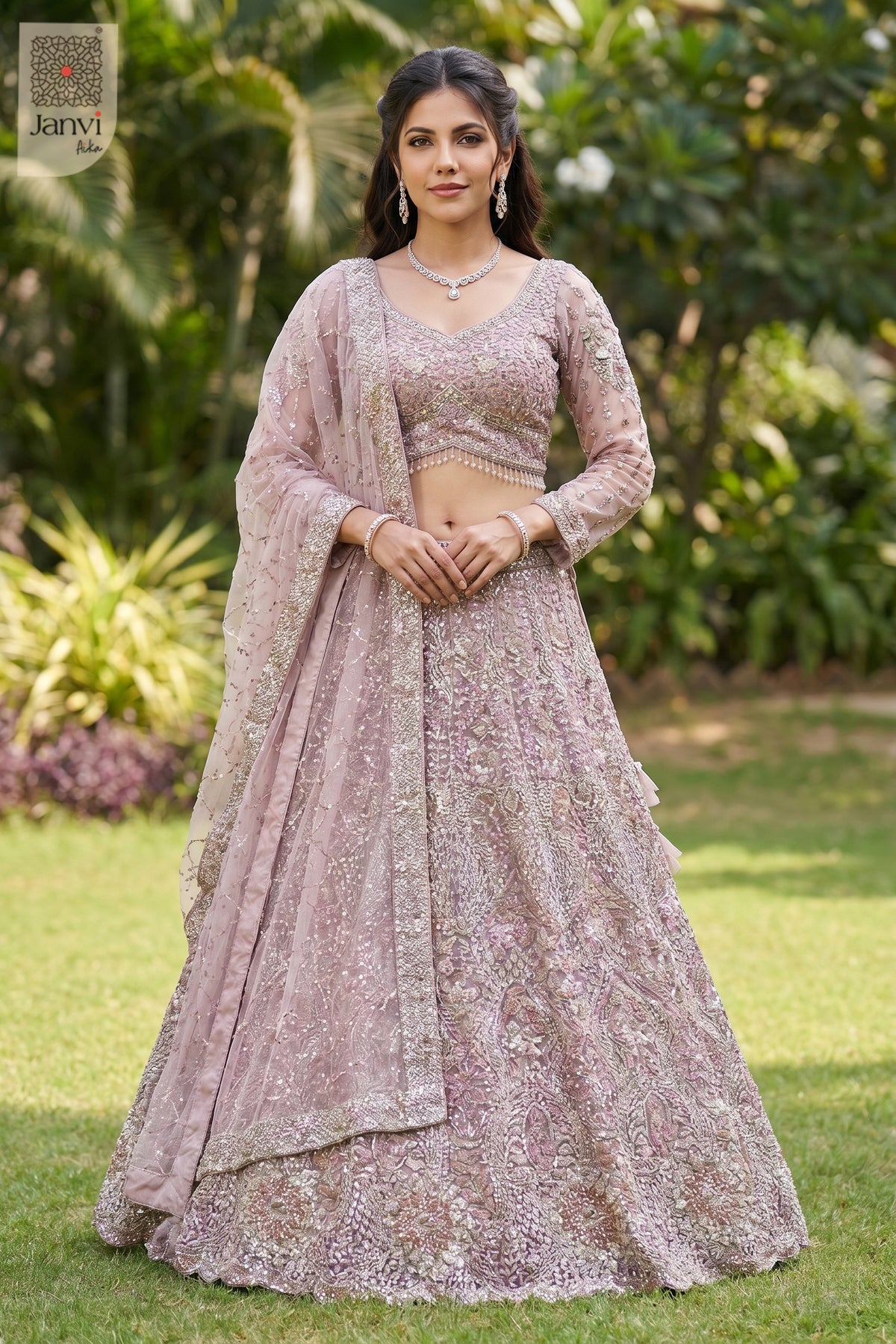 Stunning rose gold/dusty lilac net lehenga model dress with an exquisite front full standing shot.