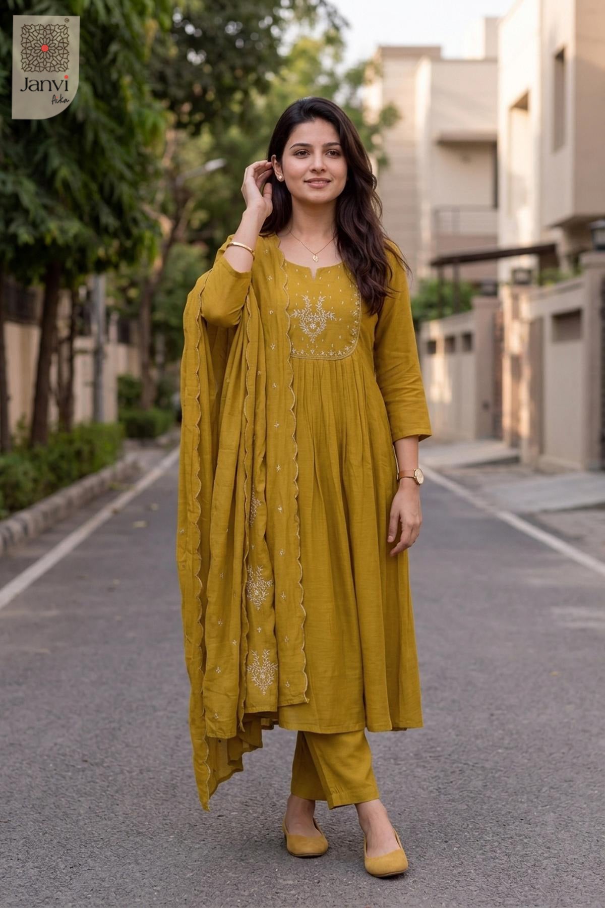 Mustard yellow silk long anarkali dress with dupatta featuring scalloped gold border.