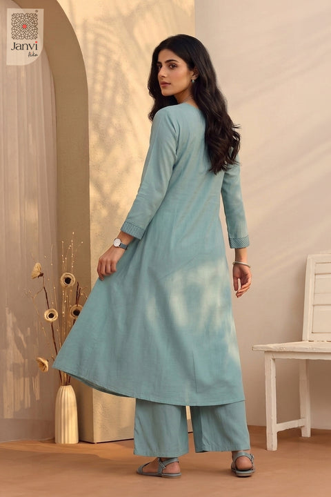 Rear view looking over shoulder in an ornate printed teal ethnic indo western kurti.