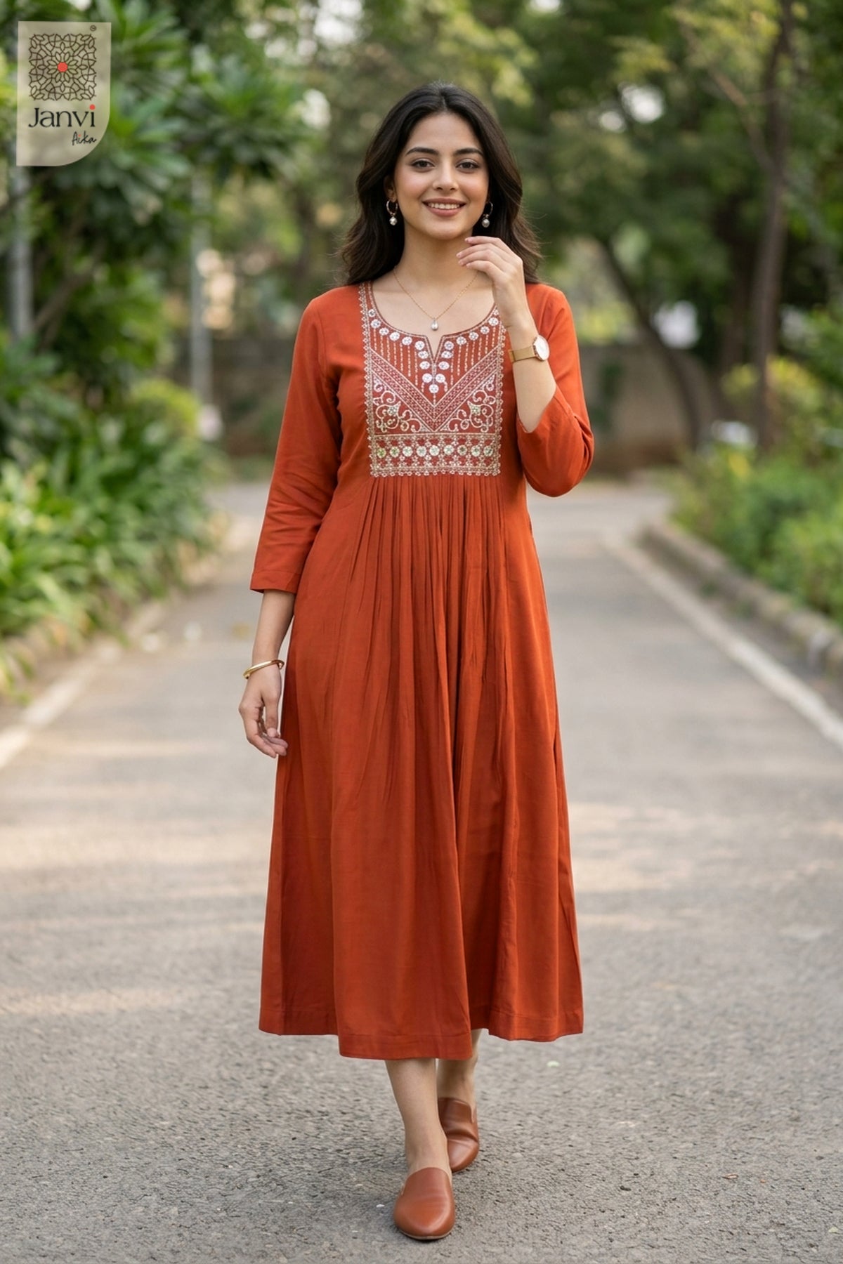 Model walking on paved garden pathway wearing rust party wear tops for women flared