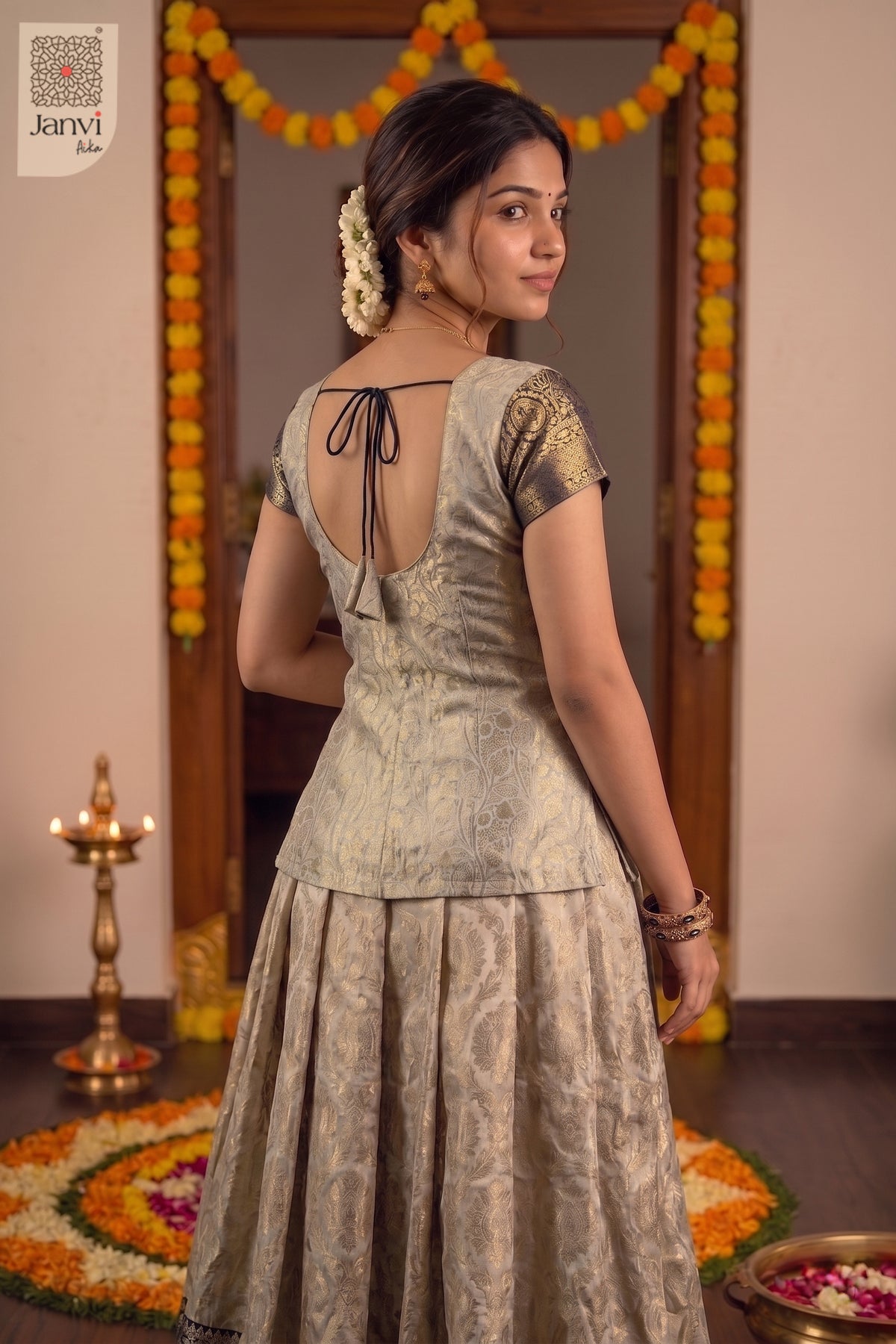 Back view showcasing designer coat for wedding with emerald scalloped border.