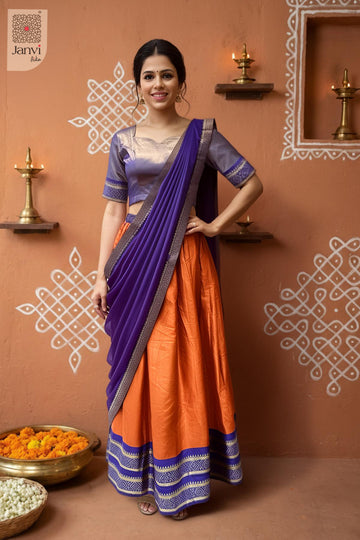 Front full standing shot of a half saree as a beautiful traditional half saree for weddings.