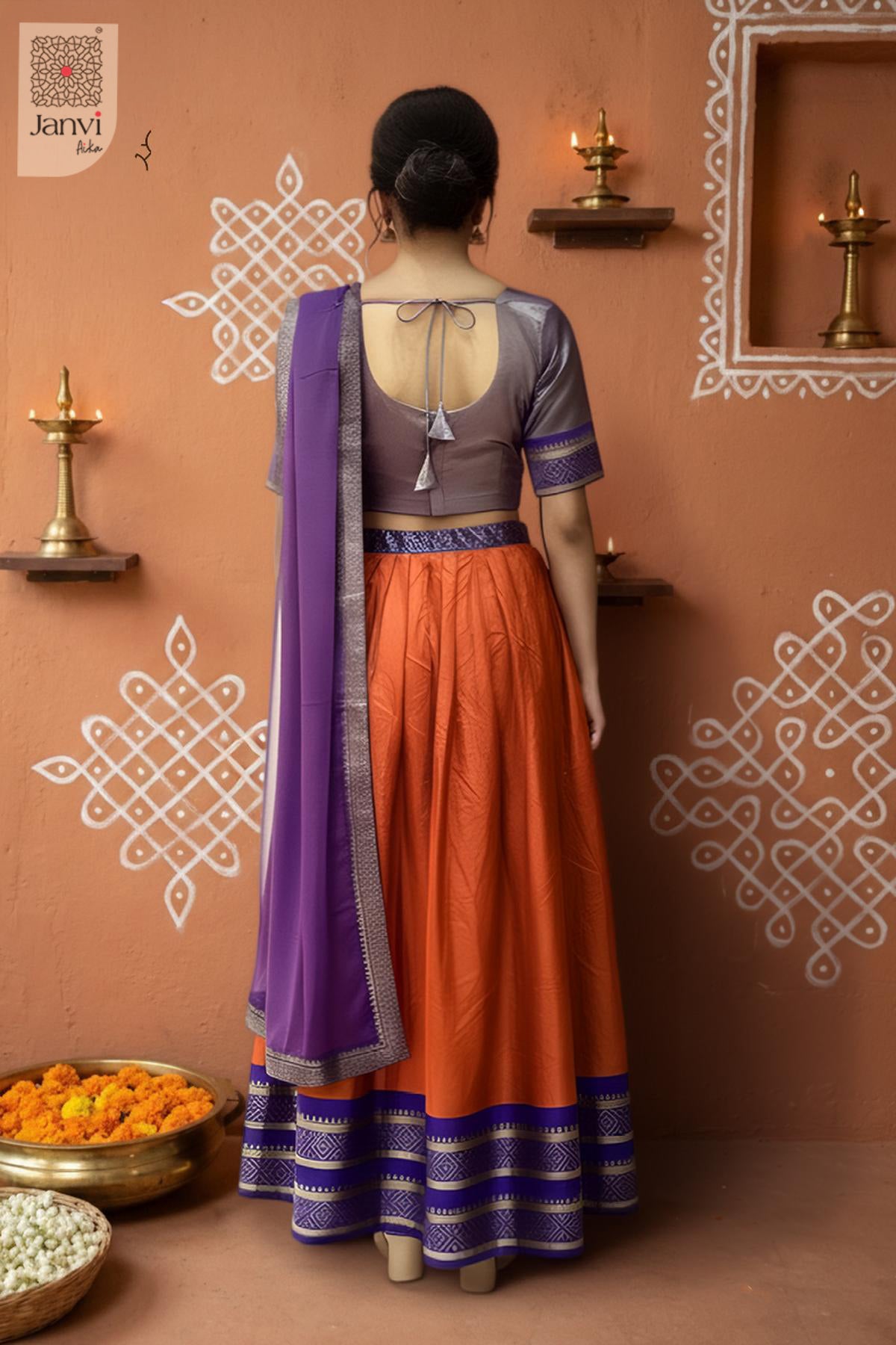 Rear full standing shot of a half saree as a beautiful women lehenga saree for weddings.
