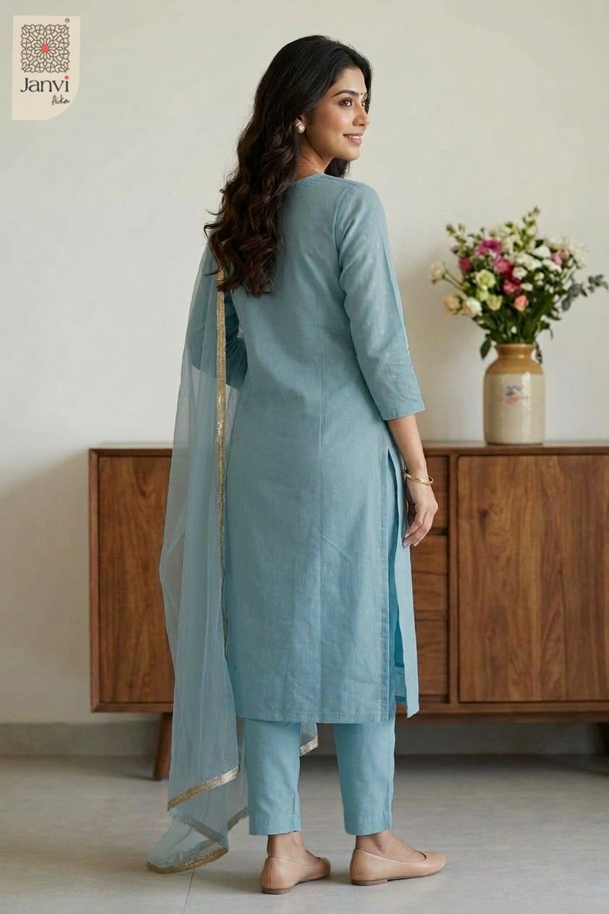 Back view showing graceful fit and printed dupatta drape of a churidar sleeves kurti.