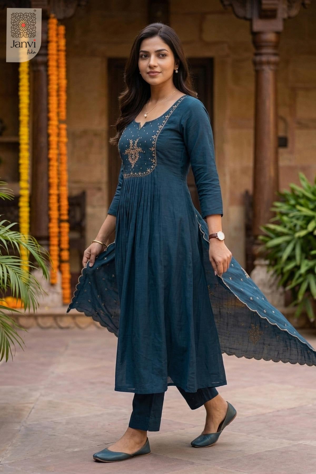 Front full length standing view of a festive teal blue flared anarkali kurta.