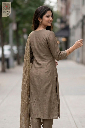 Front angled view of the flared silhouette of Champagne for black traditional dress for women.