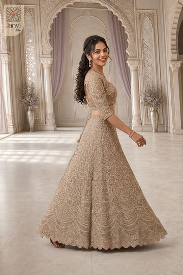Standing side profile shot of a classic net long dress with lehenga design for upcoming festivals.