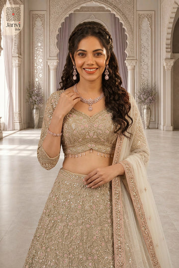 Elegant net ready made lehengas featuring a detailed waist up front smiling view.