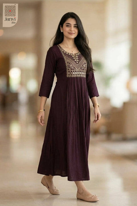 Front view of dark magenta embroidered dress tops for women in an elegant flared cut