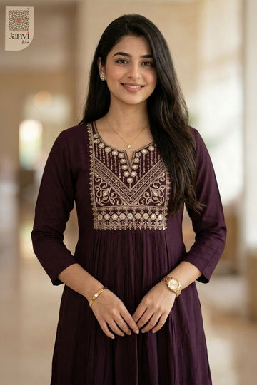 Close-up portrait of smiling woman wearing beautiful tops for women in dark magenta