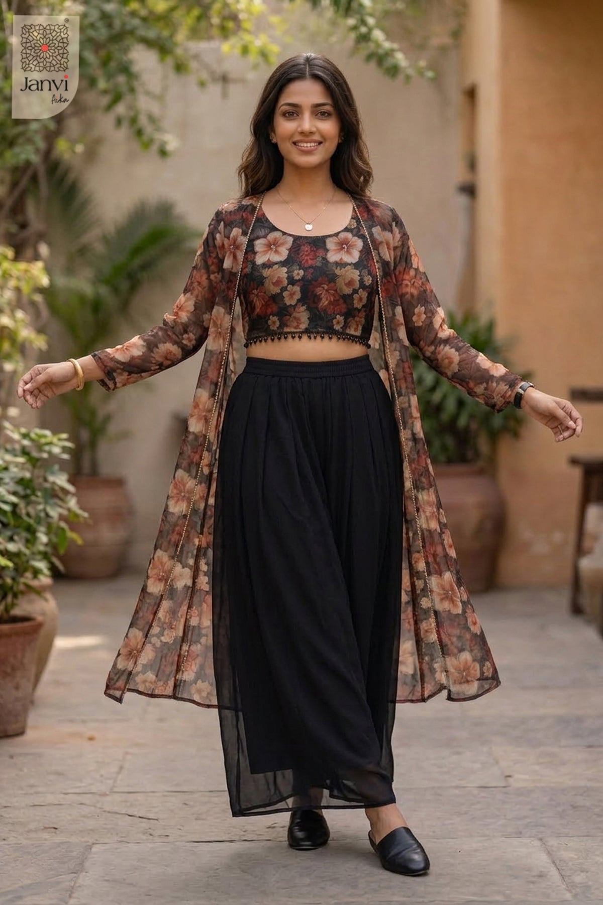 This gorgeous floral outfit features an elegantly styled crop top for girls over black pants.