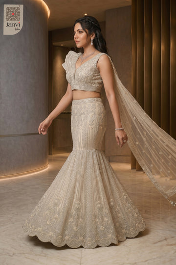 Stunning half white net plus size indian lehenga with an exquisite standing side profile shot.