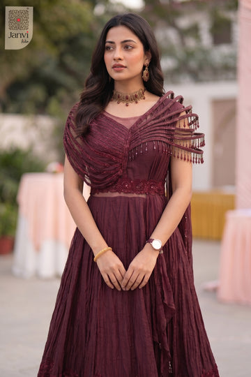 Appreciate this exquisite close up view outshining a basic maroon traditional dress for women.