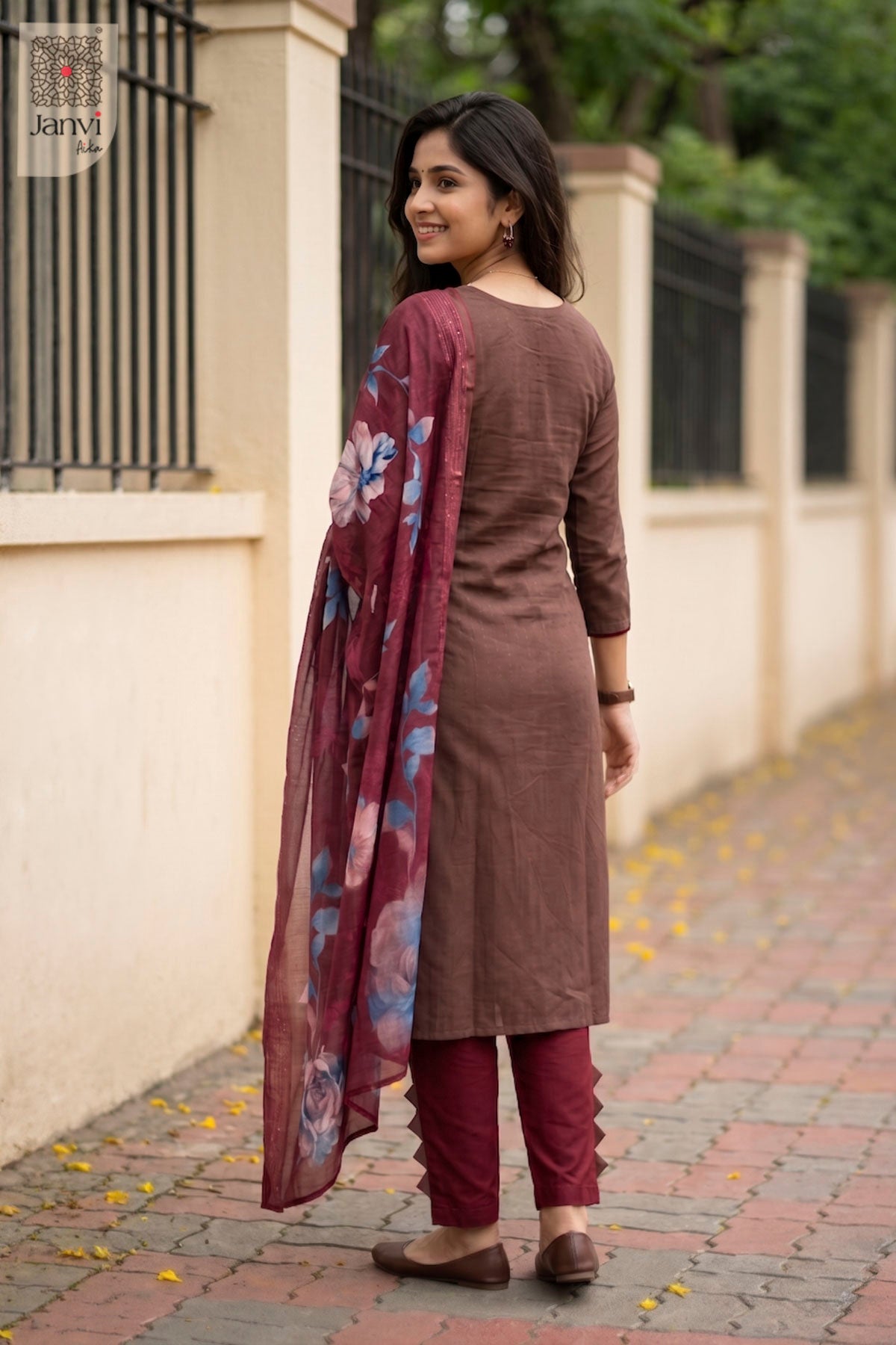 Front angled view of the flared silhouette of Gulnaar Brown for online clothes shopping websites.