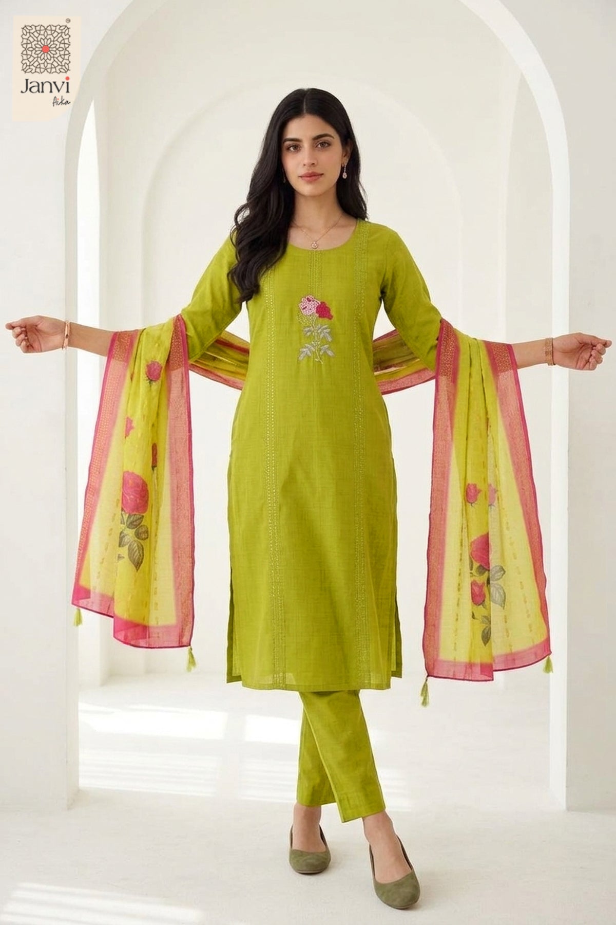 Front standing pose holding yellowish green printed scarf in a churidar set with dupatta.