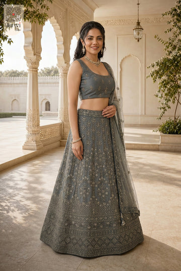 This front full standing shot showcases a gorgeous grey net purple pink lehenga for weddings.