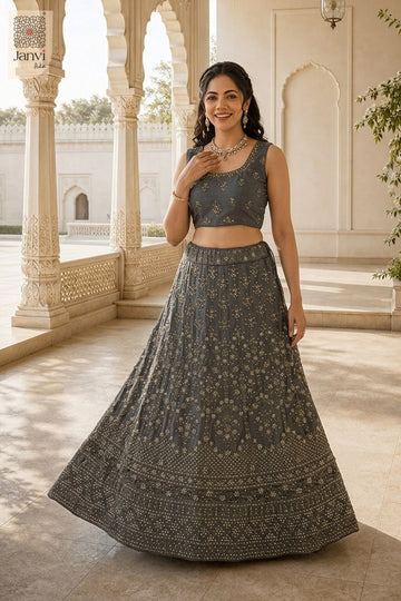 Charming dulhan lehenga design showing a lovely front full standing shot in a grey net style.