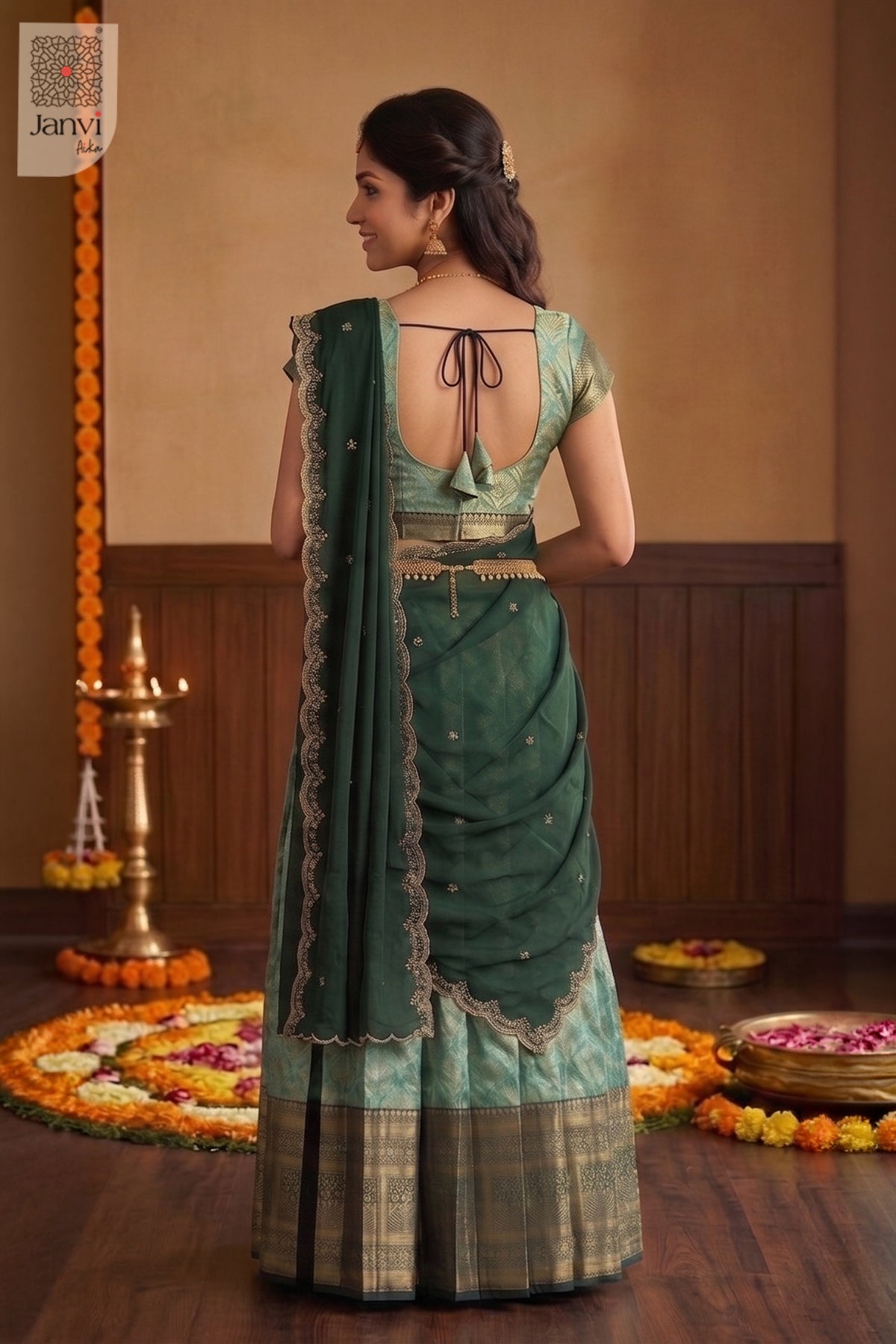 Rear view of south indian lehenga saree in jade green with wide woven borders.