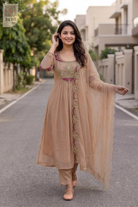 Outdoor walking sequence pose in a festive light peach embroidered anarkali kurta set.