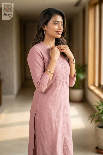Three-quarter view of Luxey Soft Rose from the 2 piece outfits for ladies range with elbow sleeves.