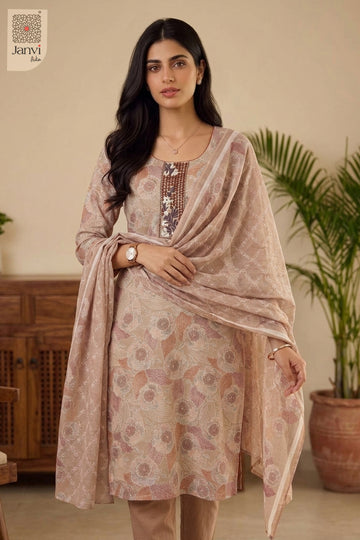 Indoor portrait highlighting intricate sequin yoke on light peach red silk churidar set.