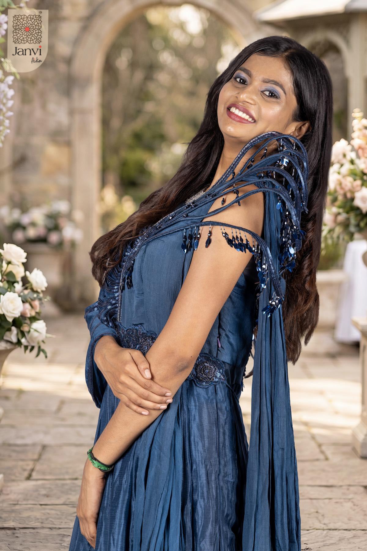 Enchanting waist up view displaying alluring navy blue indian clothes for your next grand event.