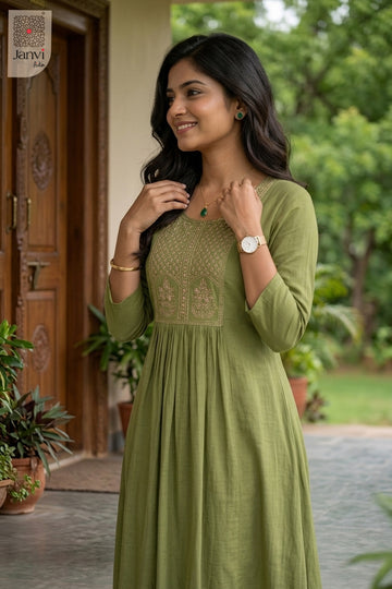 Front angled view of the flared silhouette of Mint Serena for simple party wear dress for ladies.