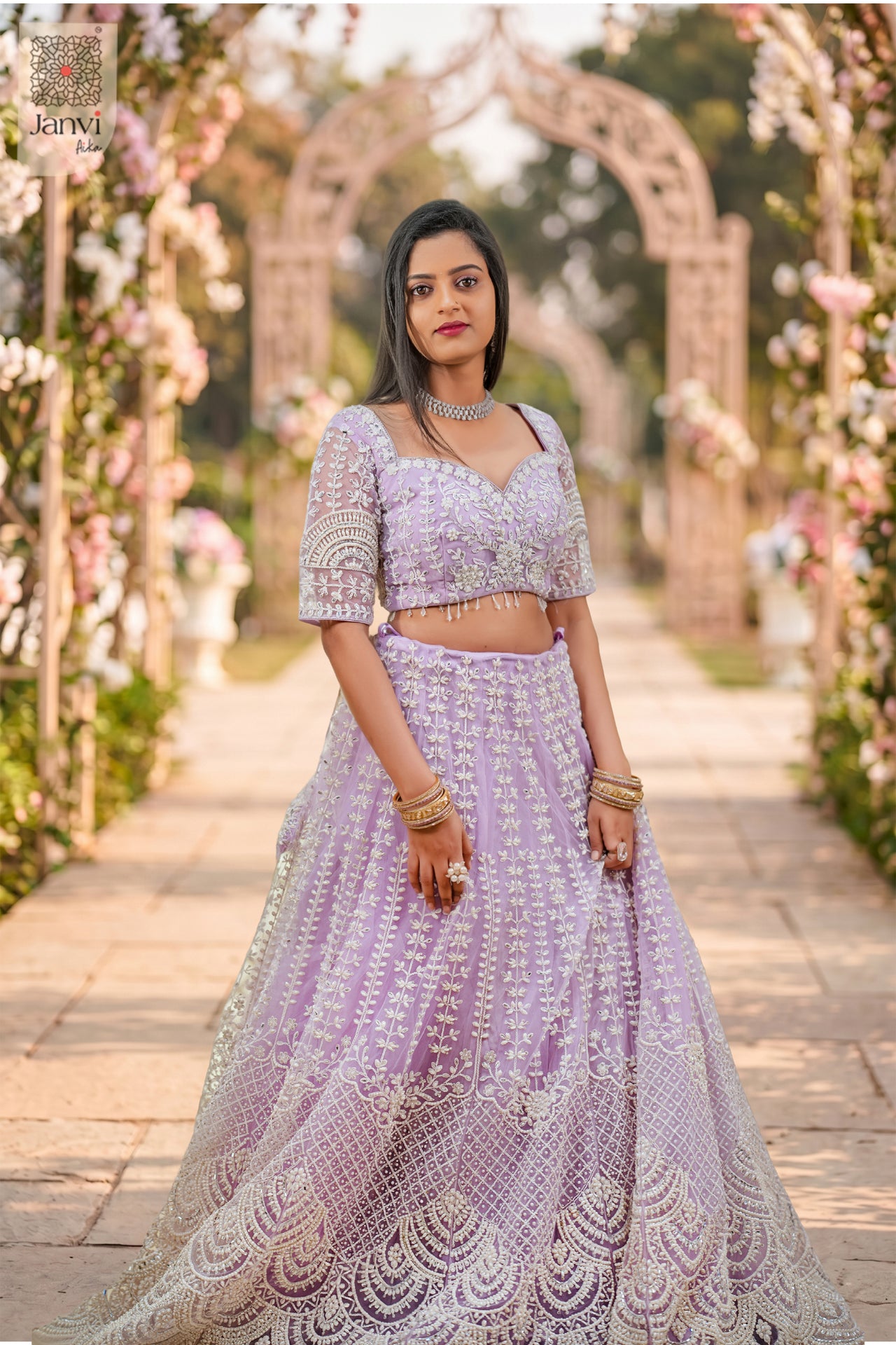 Elegant lavender net saree come lehenga featuring a detailed front full standing shot.