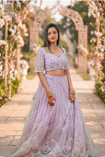 Elegant lavender net saree come lehenga featuring a detailed front full standing shot.