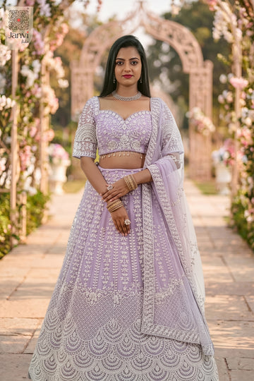This front full standing shot showcases a gorgeous lavender net lavender colour lehenga choli.