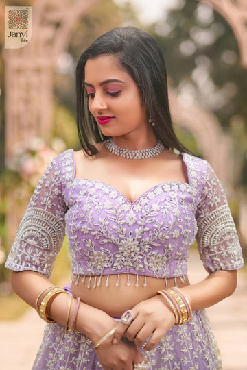 Front angled view of the flared silhouette of Mrinalika for designer lehenga for wedding party.