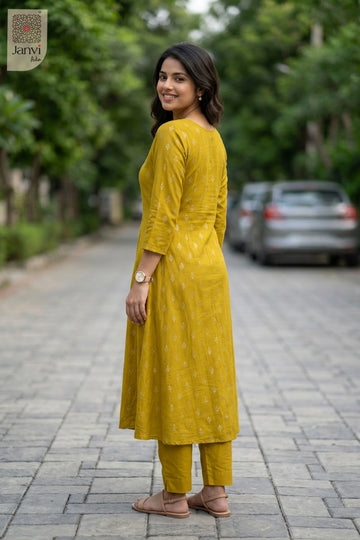 Front angled view of the flared silhouette of Mustard for casual birthday party outfits for ladies.