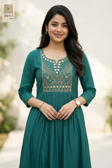 Smiling portrait of model in dark cyan party wear tops for women with fine embroidery