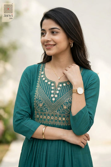 Three-quarter angle view of dark cyan cotton kurti tops with ornate embroidered yoke