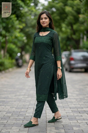 Waist-up front view of Nyra Deep Green presenting style for women's black dresses with sleeves.