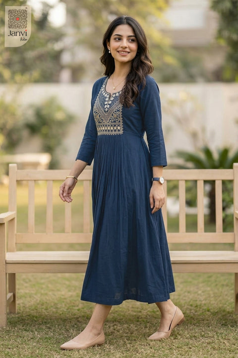 Model standing by garden bench in naval night 3 4 sleeve tops for women in flared cut