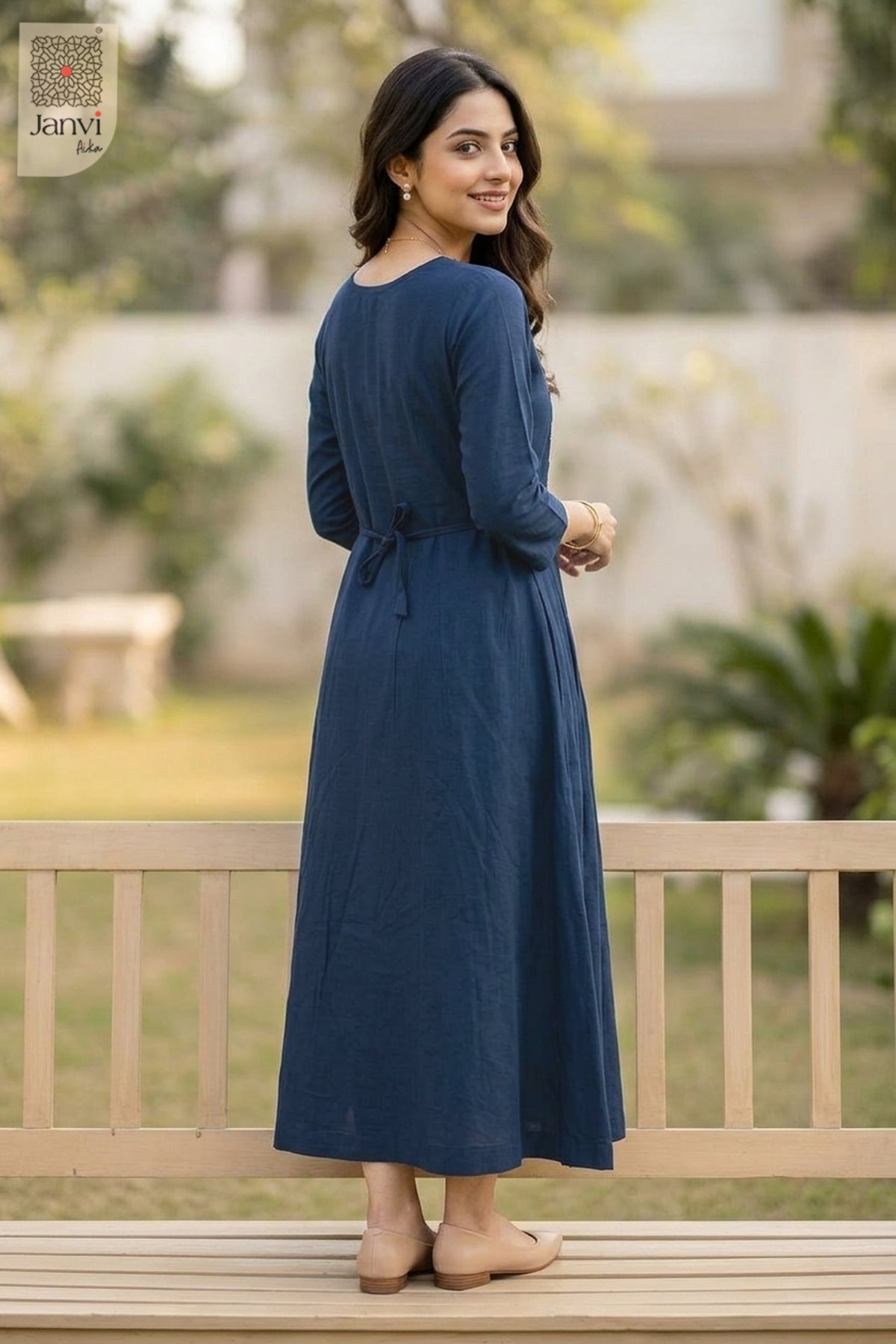 Back view of model in naval night flared ladies party tops with back tie detailing