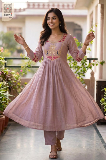Full twirling motion displaying the wide festive flare of light lavender anarkali lehengas.
