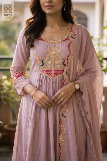 Close up view of peacock floral yoke embroidery on a light lavender short anarkali kurti.