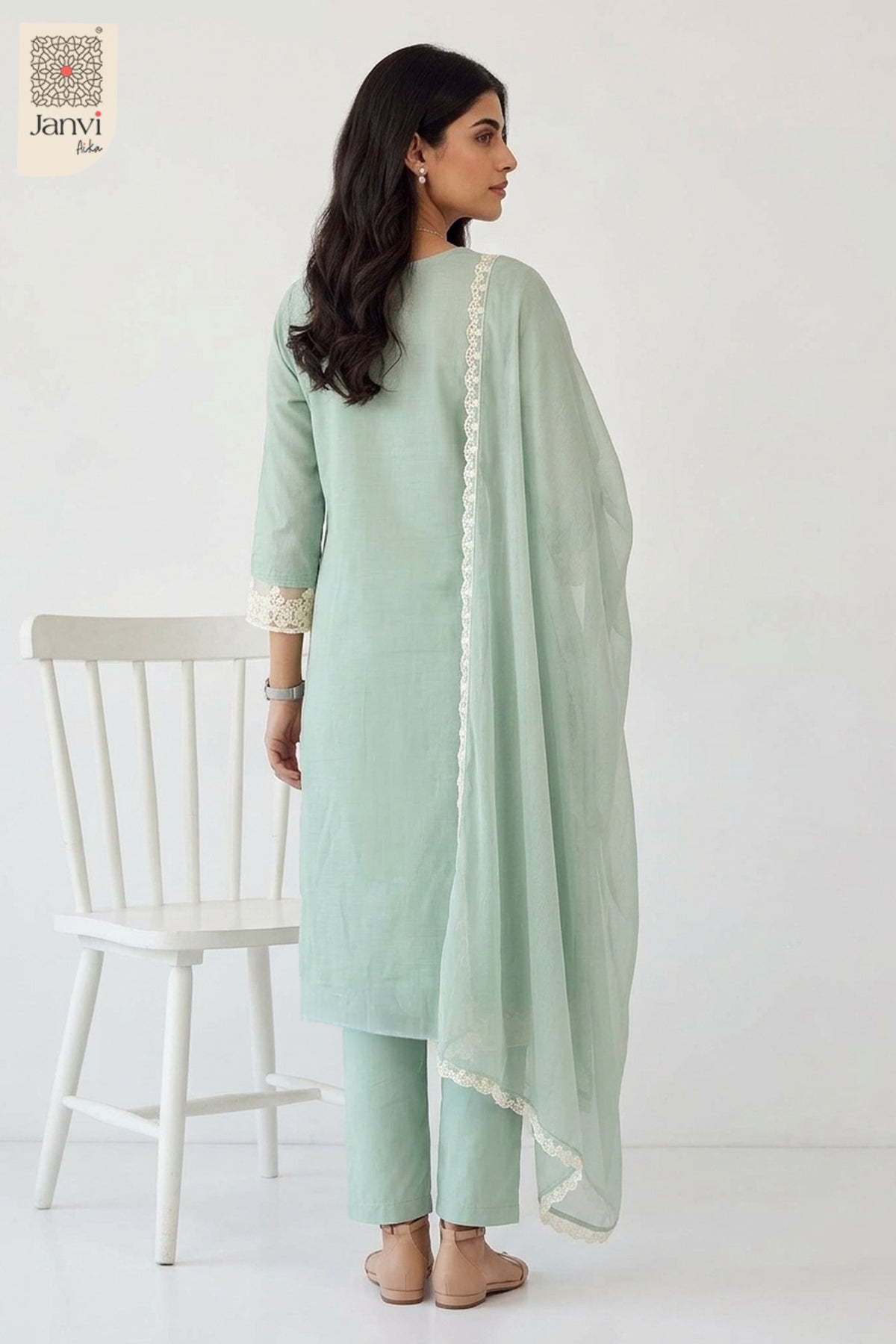Rear view showing printed back and sheer dupatta drape of a churidar sleeves kurti.