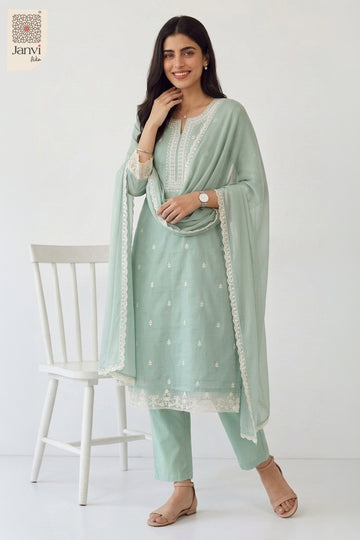 Standing studio portrait highlighting tailored fit of a lavender churidar set readymade.