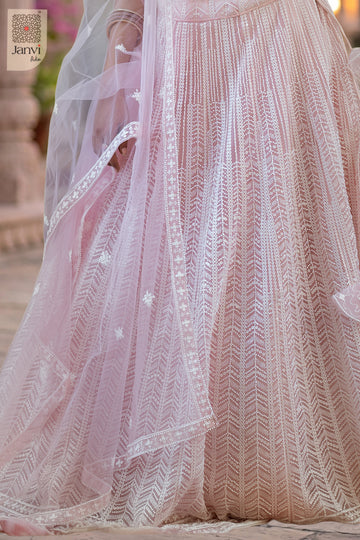 Charming saree worn as lehenga showing a lovely fabric weave close up view in a pink net style.