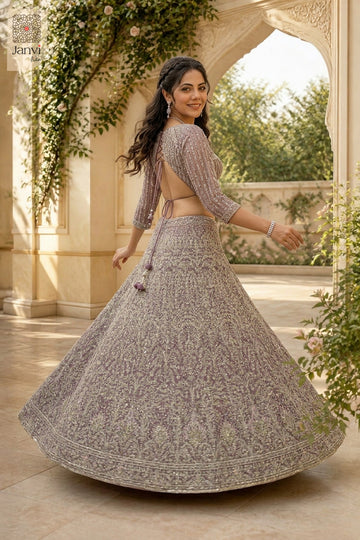 Stunning onion peel net saree lehenga blouse with an exquisite rear full standing shot.