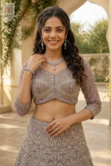 Waist up front smiling view of a classic onion peel net lehenga ka price design.