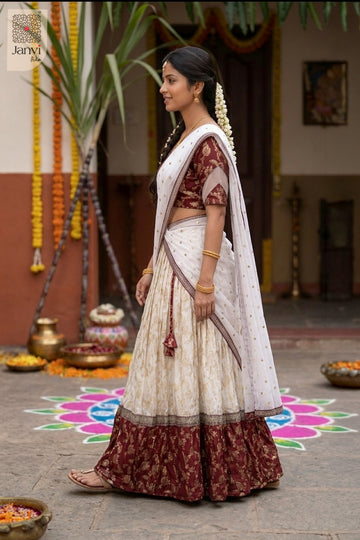 Standing side profile shot of a half saree as a beautiful lehenga as half saree.